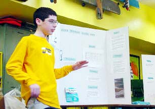 Kevin explains his science fair project to class...